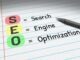 SEO - Search Engine Optimization. Business acronym on note pad.